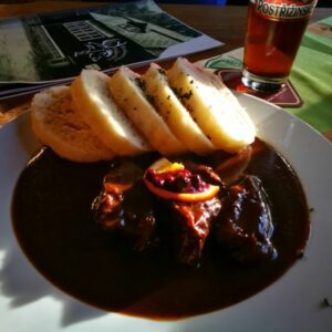Have wild boar made with rosehip sauce in the pub frequented by B. Hrabal